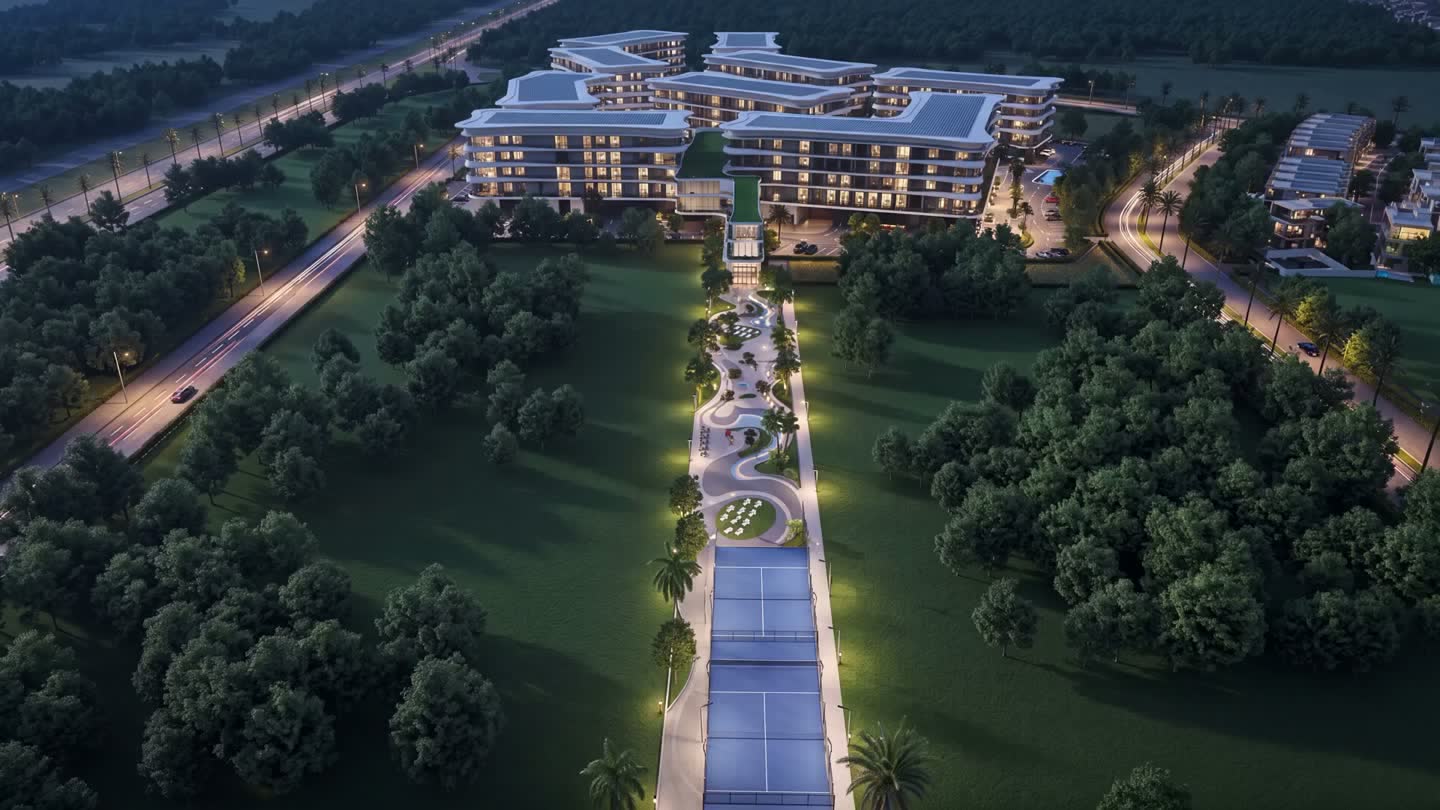 Aerial view of the Dubai Lifestyle City development at dusk